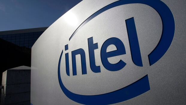 Intel logo is shown here in this January 2011 photo taken at its headquarters in Santa Clara, Calif. The chipmaker announced plans Tuesday to eliminate about 12,000 jobs as sales of personal computers fall.