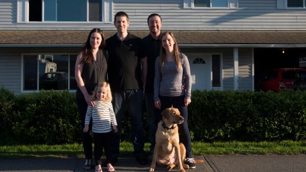 Jeremy Campbell along with his wife Holly Foran and dog Jake, right, bought a house together with Ryan and Christina Ingham and their two-year-old Regan.