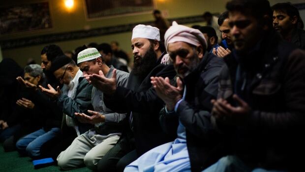 Worshippers take part in Friday prayers inside a mosque. The rise of Daesh in the Middle East and high-profile terrorist attacks in Ottawa, Paris and Brussels have shifted public opinion in a way that puts the onus on western Muslims to prevent "their own people" from committing such acts.
