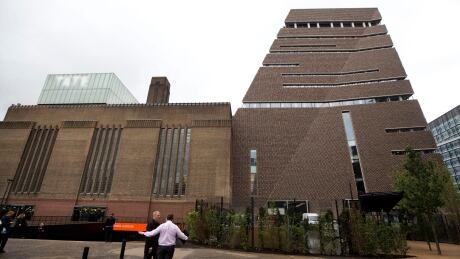An exterior view shows a new building called the Switch House, at right, which has been added on to the Tate Modern gallery in London, Tuesday, June 14, 2016.
Britain Tate Modern