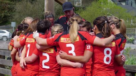 John Tait, centre, is the head coach of the Canadian women's rugby sevens program. He was responsible for choosing the 12 women who will become Rio Olympians. john-tait