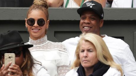 LONDON, ENGLAND - JULY 09: Jay Z and Beyonce watch on as Serena Williams of The United States and Angelique Kerber of Germany play in the Ladies Singles Final match on day twelve of the Wimbledon Lawn Tennis Championships at the All England Lawn Tennis and Croquet Club on July 9, 2016 in London, England. 596729271AP00429_Day_Twelve