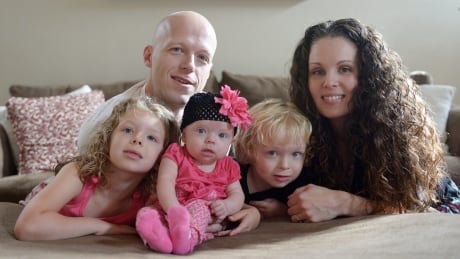In this Sept. 1, 2014, photo, Willow Short, 4-month-old, center, along with her parents Megan and Mark and sister Liana, 6, and brother Mark, 3, poses for a photo in Sinking Spring, Pa. Willow Short had a heart transplant at 6-days-old. The couple featured in news stories about their difficulties getting medication for the daughter who had a heart transplant were found shot to death in their home along with their three children in apparent murder-suicide, authorities said Sunday, Aug. 7, 2016. APTOPIX Five Die-Pennsylvania