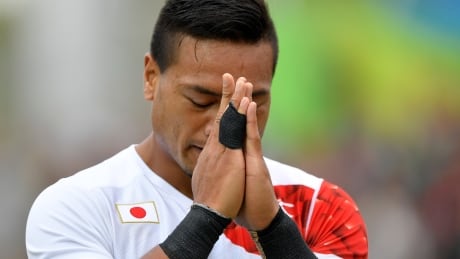 TOPSHOT - Japan's Lomano Lemeki celebrates scoring a try in the mens rugby sevens match between Kenya and Japan during the Rio 2016 Olympic Games at Deodoro Stadium in Rio de Janeiro on August 10, 2016. (Philippe Lopez/AFP/Getty) Rio Olympics Day 5 Aug 10 2016 highlights Japan rugby