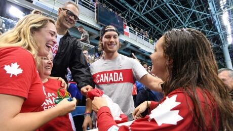 Penny Oleksiak, right, set off an online firestorm with her gold-medal performance Thursday night. oleksiak-family-11-08-2016