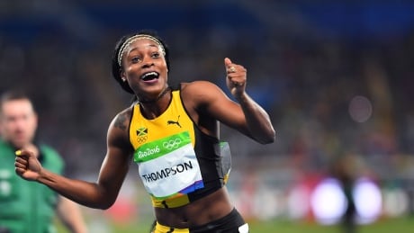 Jamaica's Elaine Thompson celebrates after she won the Women's 100m Final during the athletics event at the Rio 2016 Olympic Games at the Olympic Stadium in Rio de Janeiro on August 13, 2016. Carl De Souza/AFP/Getty) Rio Olympics Day 8 highlights Aug 13 2016 elaine thompson wins 100m