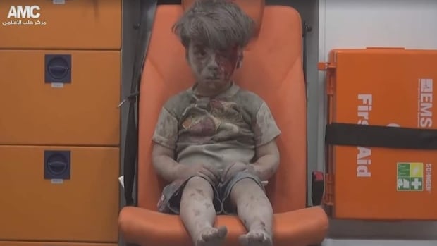 Five-year-old Omran Daqnee was pulled, bloodied and dazed, from the rubble of a hospital in Aleppo, Syria, following an airstrike Wednesday night. 