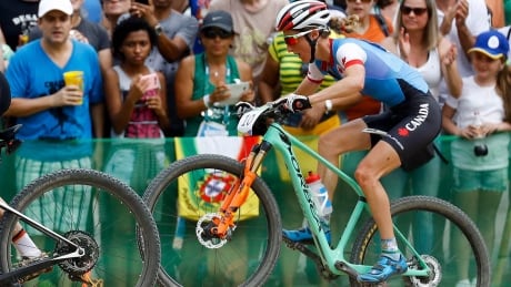 Catharine Pendrel of Canada competes in the women's cross-country mountain bike race at the Rio Olympics on Saturday. The Kamloops, B.C., rider won a bronze medal in a time of one hour 31 minutes 41 seconds. pendrel-catharine-160820-1180