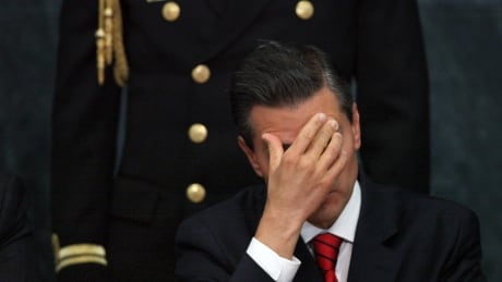 FILE - In this Jan. 21, 2015, file photo, Mexico's President Enrique Pena Nieto listens in during an act to promote housing for lower income families, single mothers and members of the armed forces, at the Los Pinos presidential residence in Mexico City. Mexico Embattled Presidency