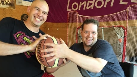 Steve Sampson (left), who has full use of his legs, enjoys playing the parasport of wheelchair basketball with disabled players like Andrew Seely (right). Steve Sampson and Andrew Seely