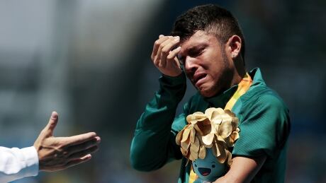Brazil's Petrucio Ferreira dos Santos tears up after recieving his gold medal from the men's 100 T47 final. Brazil Medallist Paras Gallery 4