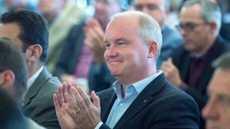 Leadership hopeful Erin O'Toole applauds as interim leader Rona Ambrose addresses the national Conservative summer caucus retreat in Halifax on Tuesday, Sept. 13, 2016. The two-day event will allow the party to prepare for next week's return of Parliament. Conservative Caucus 20160913