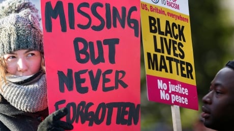 A woman holds up a sign as she participates in the 7th annual memorial march to raise awareness for the hundreds of missing and murdered aboriginal women in Montreal, Sunday, February 14, 2016.THE CANADIAN PRESS/Graham Hughes
========
A supporter of the UK branch of "Black Lives Matter" takes part in a demonstration in London, Britain August 5, 2016. REUTERS/Peter Nicholls - RTSL8VR MMIW and Black Lives Matter composite