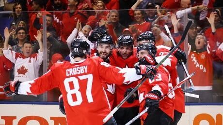 Team Canada celebrates after Brad Marchand scored to help his team advance to the final over Russia at the World Cup of Hockey. marchand-crosby