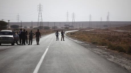 A Canadian and two Italians were held at gunpoint Monday along a Libyan highway, like this one shown in 2011. Mideast Libya