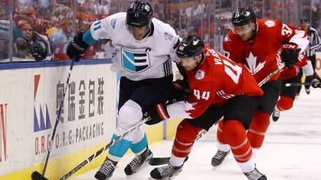 Team Europe's Anze Kopitar battles for the puck with Canadian defenceman Marc-Edouard Vlasic during Game 1 of the World Cup of Hockey final on Tuesday. Kopitar-Anze-09272016
