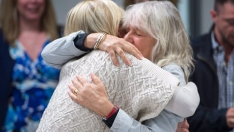 Kimberley Manning, left, and Margie Mendell, friends and colleagues of Canadian professor Homa Hoodfar, hug as they celebrate her release Monday, September 26, 2016 in Montreal. Hoodfar was rearrested June 6 and had been held at Tehran's notorious Evin prison until her release. Iran Cda Professor 20160926