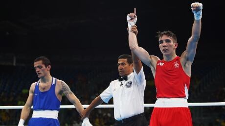 Ireland's Michael Conlan, right, was censured by the International Olympic Committee for violating anti-betting rules. Michael Conlan