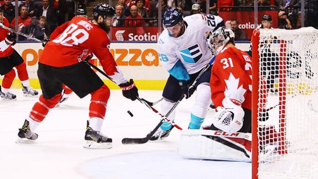 TORONTO, ON - SEPTEMBER 27: Brent Burns #88 defends as teammate Carey Price #31 of Team Canada stops a shot from Thomas Vanek #26 of Team Europe during the first period during Game One of the World Cup of Hockey final series at Air Canada Centre on September 27, 2016 in Toronto, Canada. (Photo by Bruce Bennett/Getty Images) canada-europe-160927-620