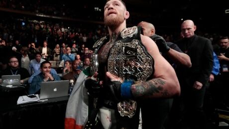 Conor McGregor now holds the UFC lightweight and featherweight belts. conor-mcgregor