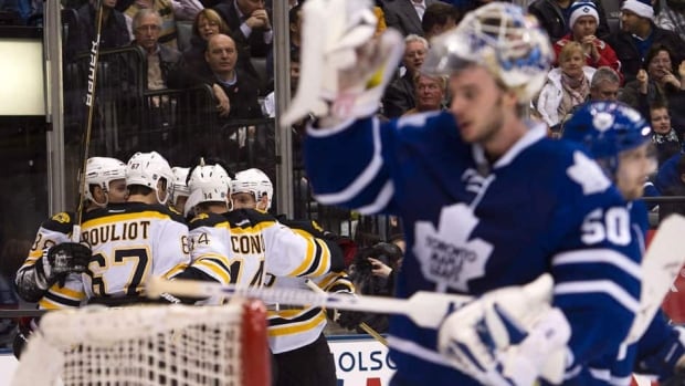 Members of the Boston Bruins and the Toronto Maple Leafs shake hands following the Bruins' Game 7 overtime win on Monday at TD Garden in Boston, Mass.