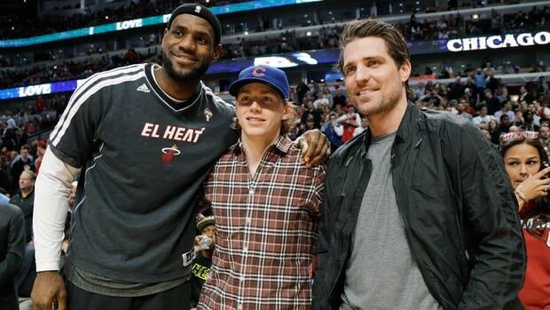 Miami Heat forward LeBron James, left, and Chicago Blackhawks' Patrick Kane, centre, and Patrick Sharp pose for a photo before Wednesday's game against the Chicago Bulls.