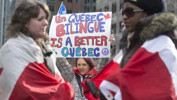 Protesters opposing language Bill 14 demonstrate outside the office of Quebec Premier Pauline Marois in Montreal, Sunday, Feb. 17.