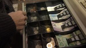 hi-bc-130103-cashier-change-coins-bills-8col