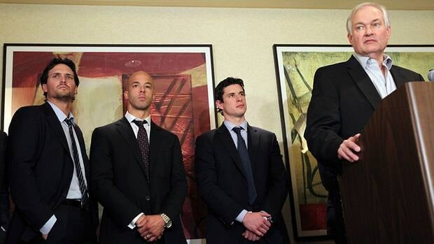 Winnipeg Jets' Ron Hainsey, left, Vancouver Canucks' Manny Malhotra, second from left, and Pittsburgh Penguins' Sidney Crosby, second from right, listens as Don Fehr, right, executive director for the NHLPA, speaks to reporters on Thursday.