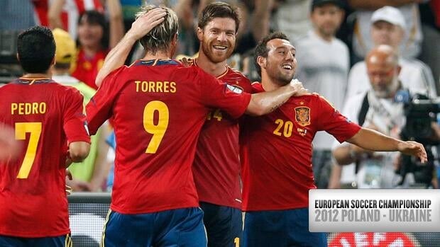 Spain’s Xabi Alonso, centre, is congratulated by teammates after scoring his second goal against France on Saturday in Donetsk, Ukraine.