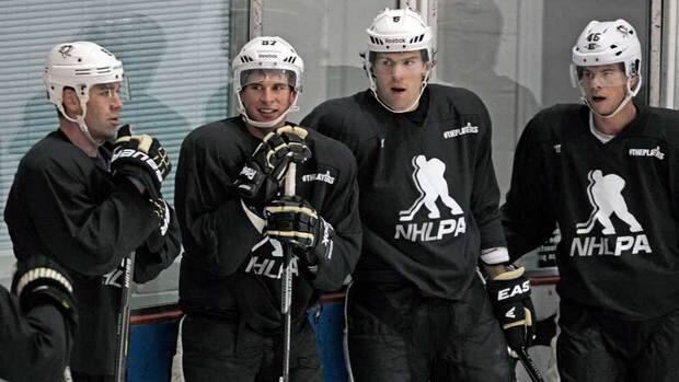 Pittsburgh Penguins hockey players, from left, Pascal Dupuis, captain Sidney Crosby, Ben Lovejoy and Tyler Kennedy will be getting ready for game shape in the next week or two.
