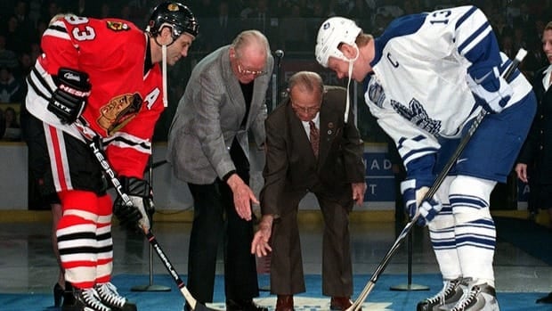In this 1999 file photo, former teammates Doug Gilmour, left, and Mats Sundin, right, take the ceremonial face off during the final game at Maple Leafs Gardens. On Tuesday, it was announced that Sundin will follow Gilmour into the Hockey Hall of Fame and Gilmour took to Twitter to give his congratulations.