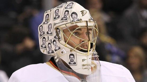 Goalie Jonas Hiller of the Anaheim Ducks wears his 'Movember' mask adorned with photos of teammates with inked on moustaches last November. Hiller has sported several different goalie masks in the past year.