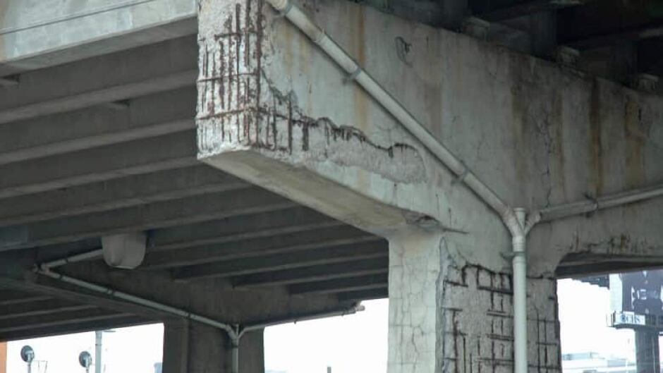 The concrete has flaked away from a column supporting a section of the Gardiner Expressway just west of Strachan Avenue. The steel rusts and expands, causing the concrete to flake away. (Andrew Lupton/CBC)