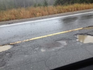 Pot holes in the road in Fleur de Lys, N.L.