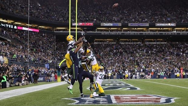 Wide receiver Golden Tate of the Seattle Seahawks makes a catch in the end zone to defeat the Green Bay Packers on a controversial call by the officials at CenturyLink Field on September 24, 2012 in Seattle, Washington.