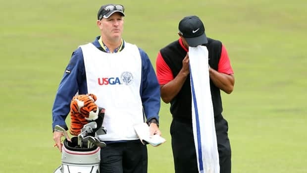 Tiger Woods waits with his caddie Joe Lacava on the second hole during the final round of the 112th U.S. Open at The Olympic Club on Sunday in San Francisco.