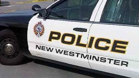 Police investigate a body found in the middle of South Dyke Road in New Westminster on Wednesday morning. li-bc-110518-south-dyke-new-west