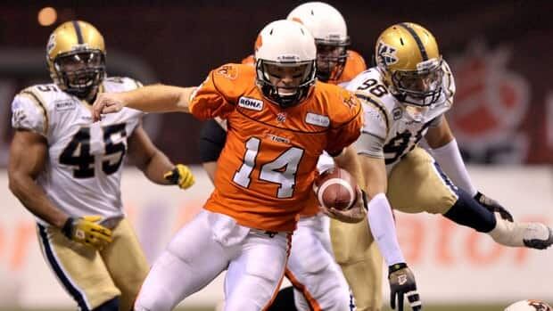 B.C. Lions quarterback Travis Lulay scrambles with the ball as Winnipeg Blue Bombers defenders give chase during Sunday's Grey Cup game.