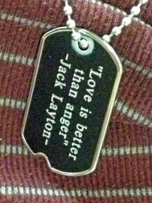 Jack Layton quote on a dog tag