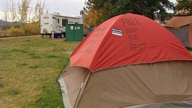 A cluster of tents, and one trailer, belonging to people with nowhere else to go, adorn the lawn of the Yukon legislature.