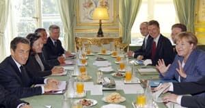 si-sarkozy-merkel-mtg-300