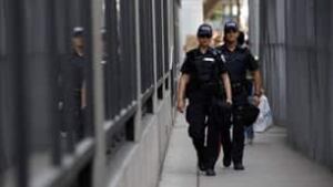 tp-toronto-100626-reuters-police-patrolling-security-fence-banner