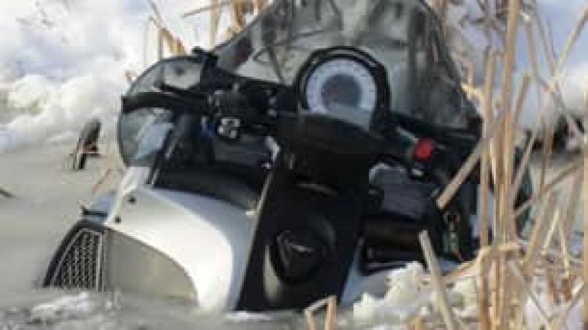 Snowmobiles submerged in Man. marsh CBC News
