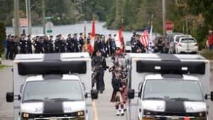 bc-101106-memorial-march-ambulances
