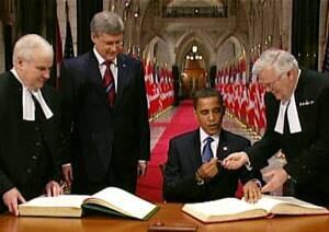 obama-signs-in-long