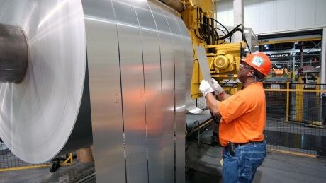Alcoa employs more than 3,000 workers at its aluminum producing plants in Quebec. hi-Alcoa-employee-aluminum-plant-smelt