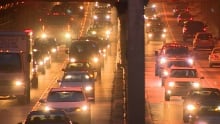 Gridlocked traffic at nighttime in one of Vancouver's busiest tunnels.
