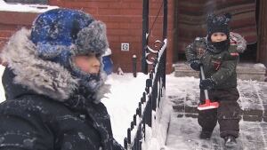 Kids clearing snow