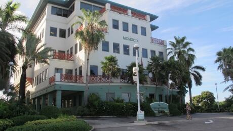 The Ugland House, the registered office for thousands of global companies, stands in George Town on Grand Cayman Island. Draft legislation proposed in Ottawa would try to track money sent to and from tax havens. Cayman Islands Haven No More